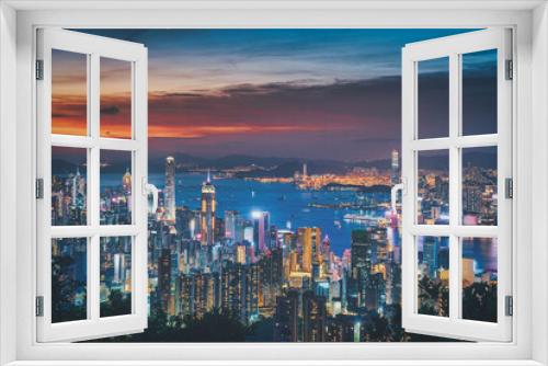 Fototapeta Naklejka Na Ścianę Okno 3D - Hong Kong city on dramatic sky at sunset view from mountain.