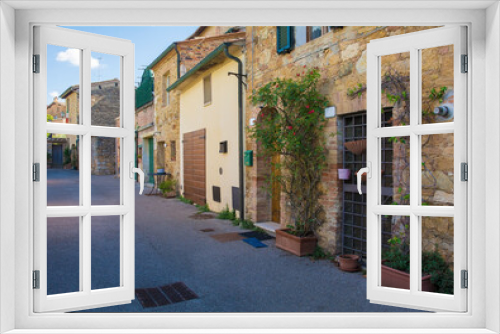Fototapeta Naklejka Na Ścianę Okno 3D - A residential road in the historic medieval village of San Quirico D'Orcia, Siena Province, Tuscany, Italy
