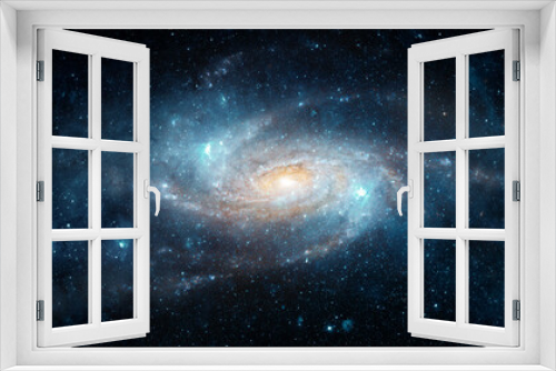 Fototapeta Naklejka Na Ścianę Okno 3D - A view from space to a spiral galaxy and stars. Universe filled with stars, nebula and galaxy,. Elements of this image furnished by NASA.