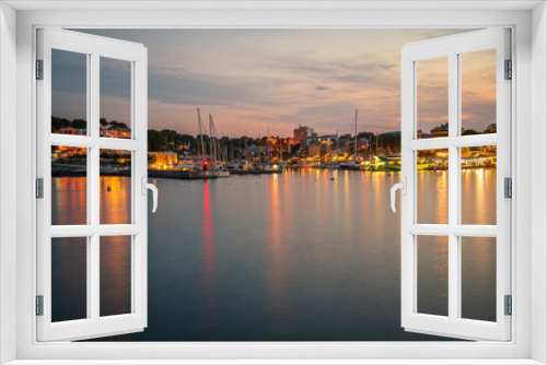 Fototapeta Naklejka Na Ścianę Okno 3D - A long exposure image of the Porto Cristo port at evening twilight on Mallorca island in Spain