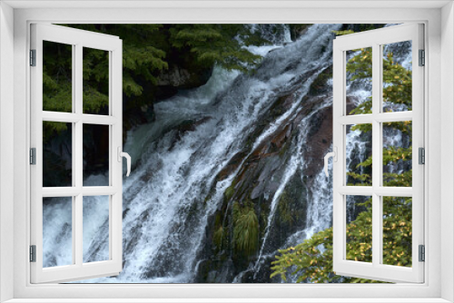 Fototapeta Naklejka Na Ścianę Okno 3D - waterfall hidden among forests nestled between high and remote mountains