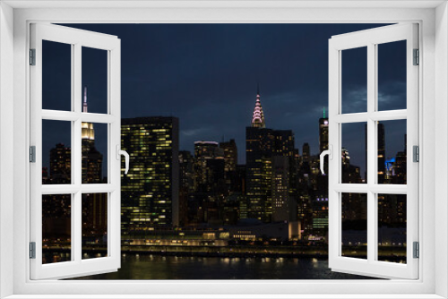 Fototapeta Naklejka Na Ścianę Okno 3D - Evening skyline of Manhattan with the Empire State Building and the Chrysler Building - New York City, USA