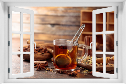 Fototapeta Naklejka Na Ścianę Okno 3D - Christmas herbal tea with cinnamon, anise, and dried herbs.