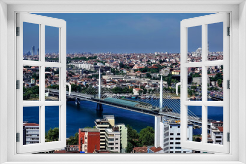 Fototapeta Naklejka Na Ścianę Okno 3D - Panorama of Istanbul from above. In the foreground is the bridge over the Bosphorus. There are many old and modern city buildings in the distance. Summer sunny day. Turkey