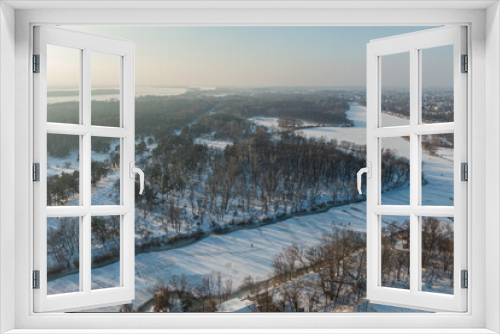 Fototapeta Naklejka Na Ścianę Okno 3D - Beautiful winter forest with a drone, near the city