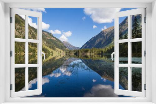 Fototapeta Naklejka Na Ścianę Okno 3D - Idyllic mountain lake in the austrian alps with blue sky