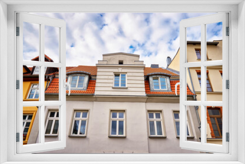 Fototapeta Naklejka Na Ścianę Okno 3D - Windows and dormers on the beautiful facades in the old town of Wismar.