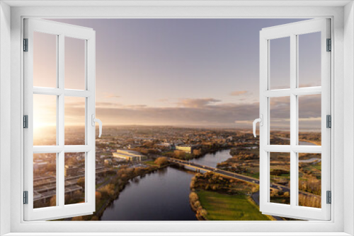 Fototapeta Naklejka Na Ścianę Okno 3D - Bridge over river Corrib, Galway city, Ireland. Sunset time. Clean sky. Aerial view.