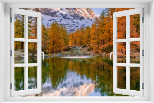 Fototapeta Naklejka Na Ścianę Okno 3D - Blue Lake and the surroundings area during the fall and changing of the colors. Foliage, reflection and snowy peaks.