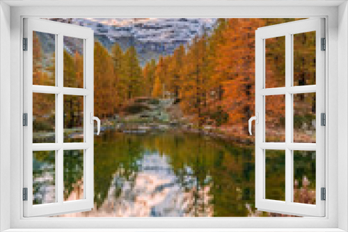 Fototapeta Naklejka Na Ścianę Okno 3D - Blue Lake and the surroundings area during the fall and changing of the colors. Foliage, reflection and snowy peaks.