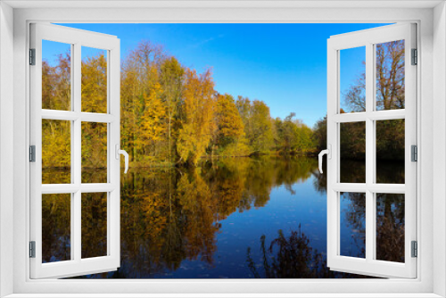 Fototapeta Naklejka Na Ścianę Okno 3D - Beautiful pastoral view from Vondelpark in Amsterdam, Netherlands. Autumn trees and their reflections on the lake. 