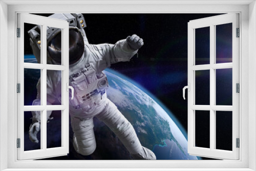 Fototapeta Naklejka Na Ścianę Okno 3D - astronaut during spacewalk in Earth orbit 