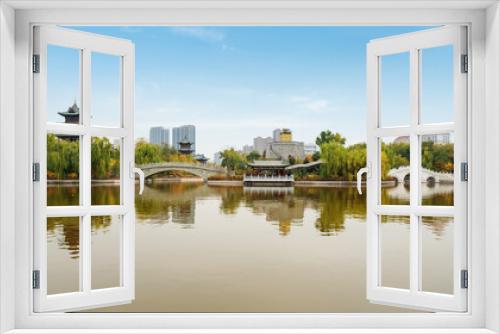 Fototapeta Naklejka Na Ścianę Okno 3D - In autumn, ancient buildings and arch bridges are in Yingze Park, Taiyuan, Shanxi Province, China