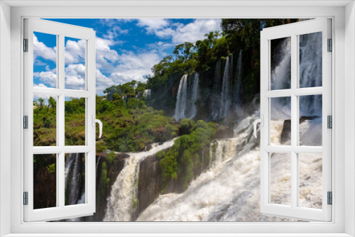 Fototapeta Naklejka Na Ścianę Okno 3D - Wonderful vivid landscape of Iguazu Falls with water streams falling down among verdant vegetation in sunny day