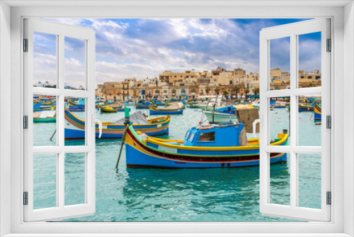 Fototapeta Naklejka Na Ścianę Okno 3D - Typical fishing boats at the village of Marsaxlokk on the island of Malta