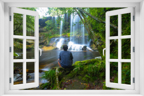 Fototapeta Naklejka Na Ścianę Okno 3D - a man in waterfall forest
