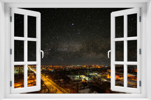 Fototapeta Naklejka Na Ścianę Okno 3D - Starry sky over the city in winter