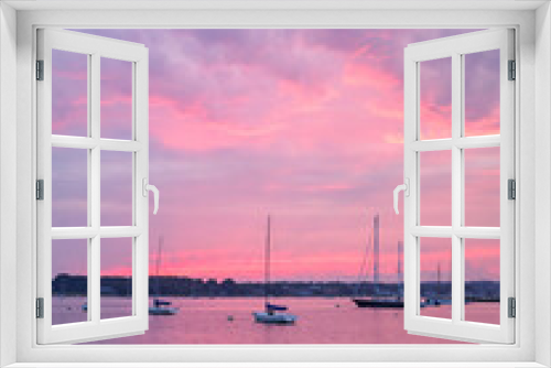 Fototapeta Naklejka Na Ścianę Okno 3D - Stonington harbor pink sunset, purple clouds and sailboats. Stonington is the only coastal Connecticut harbor on the Atlantic Ocean.
