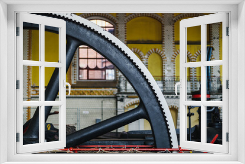 Fototapeta Naklejka Na Ścianę Okno 3D - Old steam machine, steam pump wheel. Industrial historic heritage