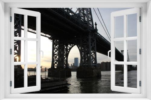 Fototapeta Naklejka Na Ścianę Okno 3D - Williamsburg bridge, New York, USA - 20/12/2019: Williamsburg bridge in New York Manhattan skyscrapers behind at sunset - stock photo