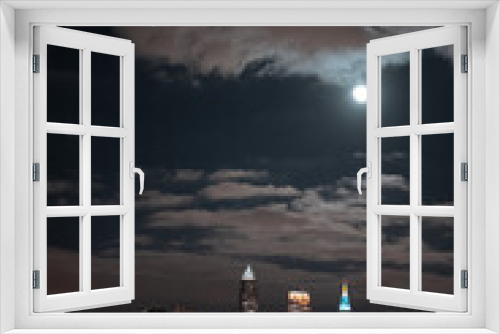 Fototapeta Naklejka Na Ścianę Okno 3D - Cleveland Ohio Skyline at night during a full moon