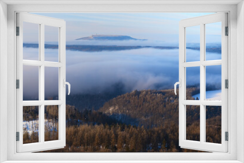 Fototapeta Naklejka Na Ścianę Okno 3D - Winter cold weather in mountains, colorful fog