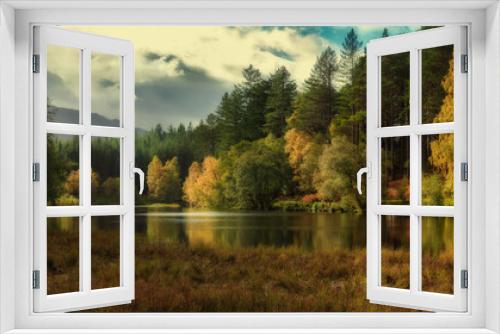 Fototapeta Naklejka Na Ścianę Okno 3D - Autumn woods on a lake in the mountains