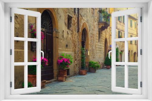 Fototapeta Naklejka Na Ścianę Okno 3D - Cozy street and entrances decorated with colorful flowers, Pienza, Italy