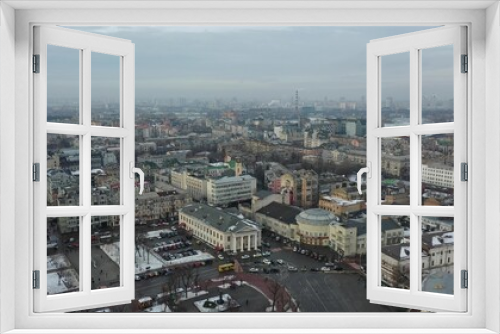 Fototapeta Naklejka Na Ścianę Okno 3D - Europe, Kiev, Ukraine - February 2021: aerial view of the Podil area, St. Andrew's Church, Kontraktova Square and Kiev. Old residential buildings overlooking the city.