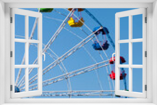 Fototapeta Naklejka Na Ścianę Okno 3D - Ferris wheel with colored booths