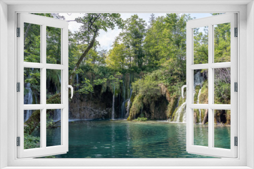Fototapeta Naklejka Na Ścianę Okno 3D - Plitvice, Croatia - Aug 11, 2020: Waterfall cascade in the lakes area in summer