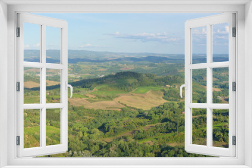 Fototapeta Naklejka Na Ścianę Okno 3D - Typical landscape with rolling hills and vineyards around San Gimignano town, Tuscany, Italy
