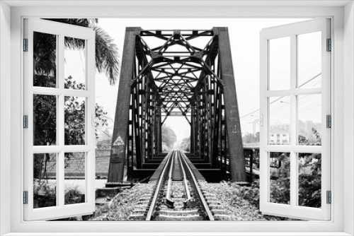 Fototapeta Naklejka Na Ścianę Okno 3D - Iron bridge on a railway line in Taling Chan, Bangkok, Thailand, black and white photographed