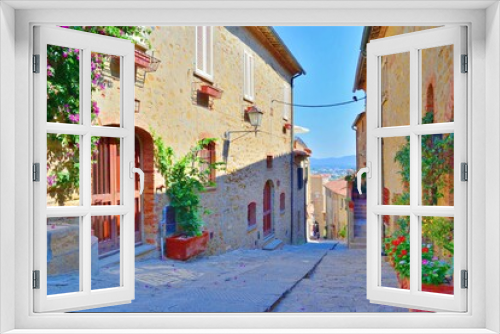 Fototapeta Naklejka Na Ścianę Okno 3D - old alley in the village of Castiglione della Pescaia, a famous medieval town overlooking the Tuscan coast in the province of Grosseto, Italy