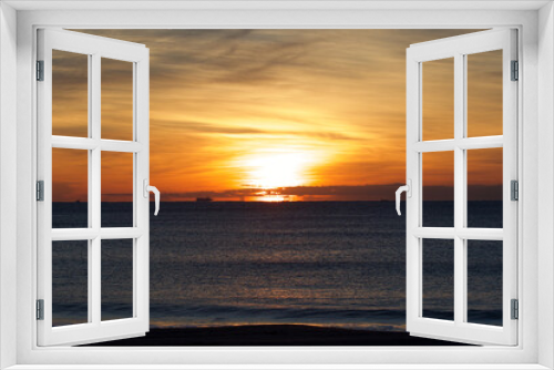 Fototapeta Naklejka Na Ścianę Okno 3D - Spring Sunrise over the Pacific ocean in Chiba Japan. An amazing orange glow with wispy clouds makes this a beautiful background image.