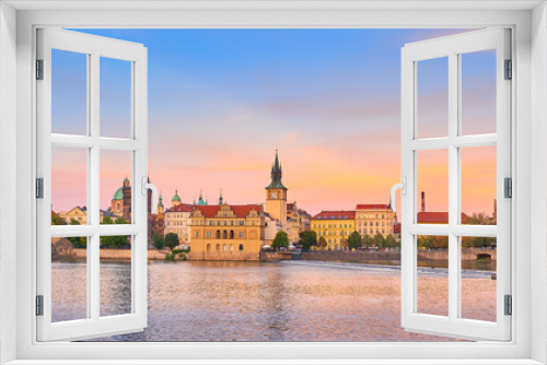 Travel destinations in Europe. Romantic Prague riverside. Panorama of Charles Bridge and historic buildings on Vltava river in Prague.