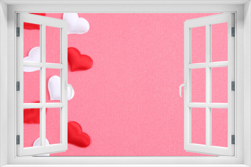 White heart and a red heart on a pink background. Concept for love day, Valentine's day, February 14th. Copy space. Valentine's Day card.