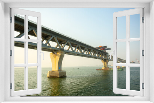 Fototapeta Naklejka Na Ścianę Okno 3D - Bangladesh – February 06, 2021: A new PADMA Multipurpose Bridge is being constructed over the river Padma at Munshiganj, Dhaka, Bangladesh.