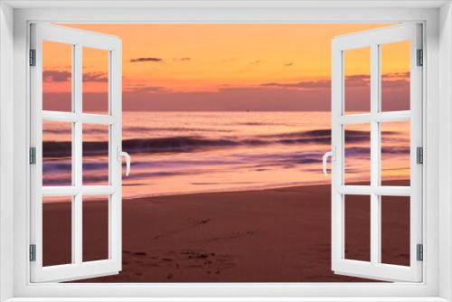 Fototapeta Naklejka Na Ścianę Okno 3D - Sandy tropical beach at sunset as a backdrop.