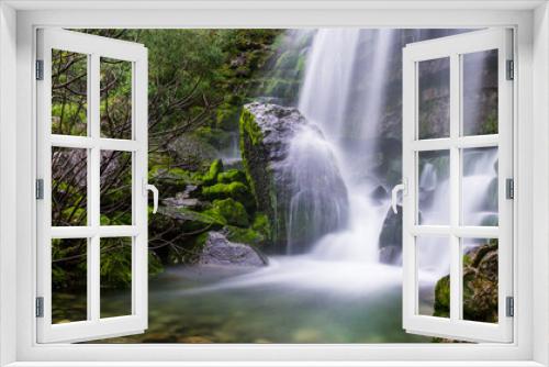 Fototapeta Naklejka Na Ścianę Okno 3D - Beautiful waterfall in the mountains of Serra de Aire, Portugal. Long exposure of the waterfall of Fornea in Porto de Mos, Portugal. 