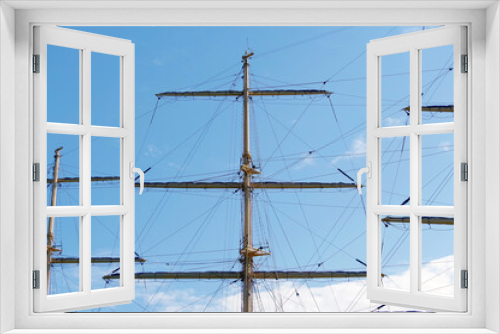 Fototapeta Naklejka Na Ścianę Okno 3D - Masts and rigging of a sailing ship against sky