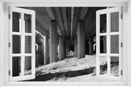 Fototapeta Naklejka Na Ścianę Okno 3D - Motorway modern concrete bridge, underneath black and white photo