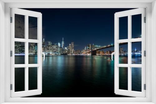 Fototapeta Naklejka Na Ścianę Okno 3D - Notturno di Manhattan con ponte di Brooklyn