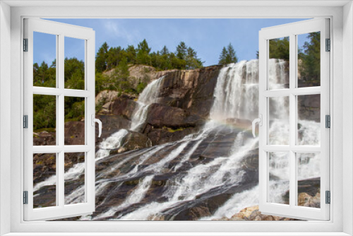 Fototapeta Naklejka Na Ścianę Okno 3D - Beautiful Furebergsfossen waterfall in Norway, waterfall on rocky slope near road along the Hardangerfjord fiord