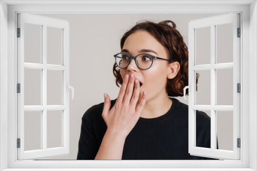 Shocked young woman with an open mouth isolated