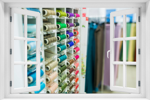 Sewing thread. thread spools background in textile store. Selective focus