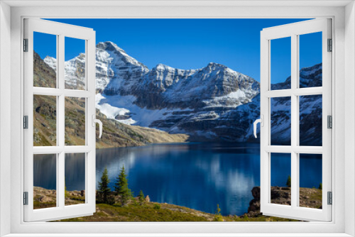 Fototapeta Naklejka Na Ścianę Okno 3D - Canadian Rockies landscape of a blue lake surrounded by mountains with snow during autumn, Lake McArthur, Yoho National Park, British Columbia, Canada