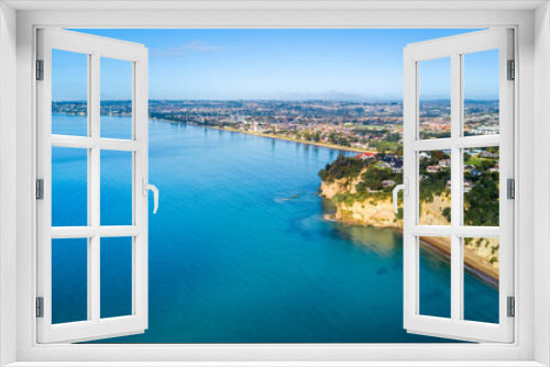 Fototapeta Naklejka Na Ścianę Okno 3D - Aerial view of a beautiful suburb on the shore of a quiet harbour on a sunny morning. Auckland, New Zealand.