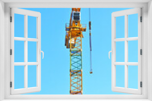 Fototapeta Naklejka Na Ścianę Okno 3D - Crane and highrise construction site
