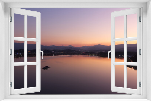 Fototapeta Naklejka Na Ścianę Okno 3D - Peaceful lake view at sunrise.